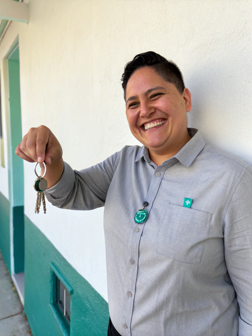 Smiling future homeowner leaning against a doorframe